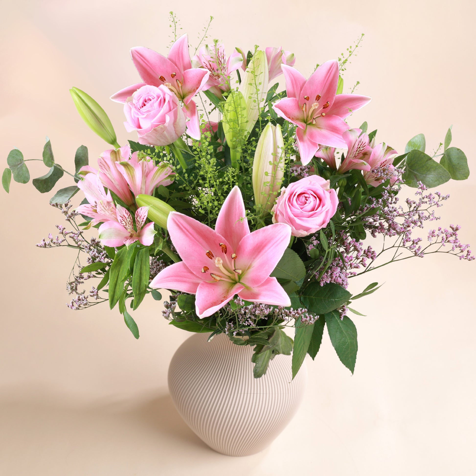 Bouquet Joli Bonheur avec lys roses et vase Harma en PLA suisse